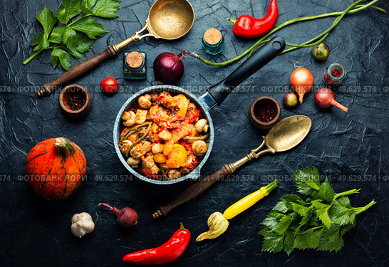 Gravy with meat,mushrooms,zucchini and potatoes.Stew meat in stewpan. Ragout with meat and vegetables. Стоковое фото, агентство Ingram Publishing / Фотобанк Лори