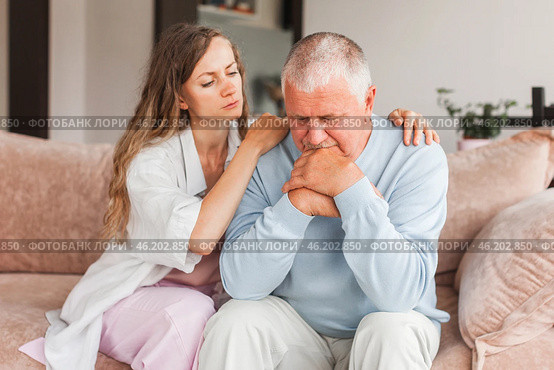 Grown up daughter soothe aged father holds his hand feel empathy give him moral support, sad elderly man at home. Стоковое фото, фотограф Гладских Татьяна / Фотобанк Лори