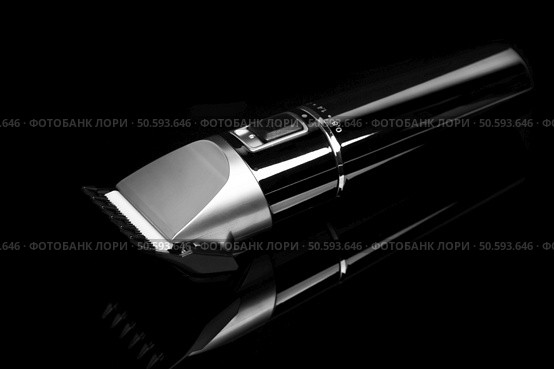 Hair clipper trimmer isolated on black background. Стоковое фото, агентство Ingram Publishing / Фотобанк Лори