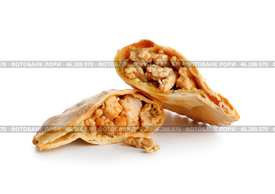 Halves of baked meat empanada on white background. Стоковое фото, фотограф Pixel_shot / Фотобанк Лори