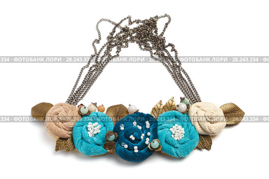 Handmade necklace in the form of several flowers of cyan, blue and beige colors on a white background. Стоковое фото, фотограф Олег Белов / Фотобанк Лори