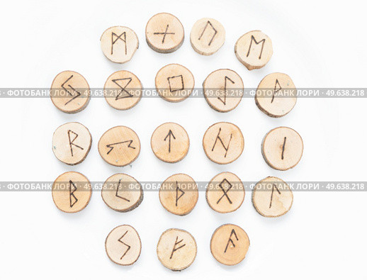 Handmade runes for fortunetelling made on wood isolated on white background. Handmade runes for fortunetelling. Стоковое фото, агентство Ingram Publishing / Фотобанк Лори