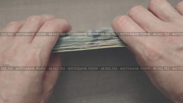 hands holding touching making order folding stack bundle of American dollar bills. Стоковое видео, видеограф Olesia Kondrateva / Фотобанк Лори