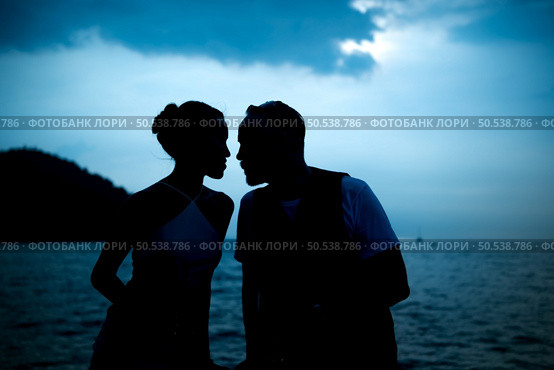 Happy moments of interracial couples on a yacht The couple had their honeymoon at one of Asia’s most beautiful seas. Стоковое фото, агентство Ingram Publishing / Фотобанк Лори