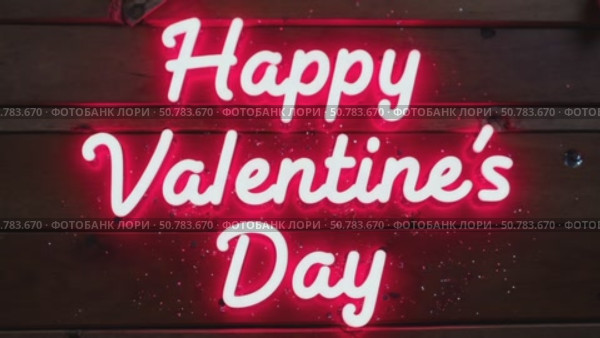 Happy Valentine's day concept. Glowing neon letters. Neon sign with glitter sparkles, wooden backbround. Стоковое AI-видео, аниматор Sergey Grishin / Фотобанк Лори