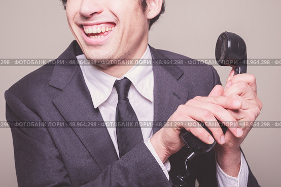 Happy young businessman is on the phone. Стоковое фото, агентство Ingram Publishing / Фотобанк Лори