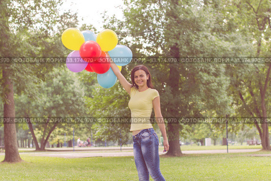 Happy Young Woman With Colorful Balloons. Стоковое фото, фотограф Mitar gavric / PantherMedia / Фотобанк Лори