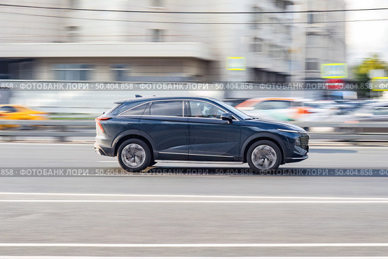 Haval Shenshou car moving on the street. SUV vehicle driving along sunny street in city with blurred background. Редакционное фото, фотограф Константин Григорьев / Фотобанк Лори