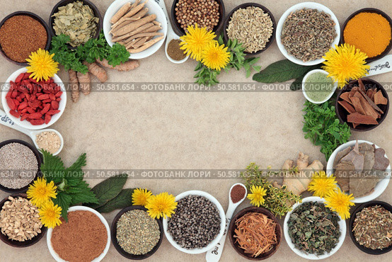 Herbal medicine selection with fresh and dried herbs amd spices forming an abstract background on natural hemp paper.  . Стоковое фото, агентство Ingram Publishing / Фотобанк Лори
