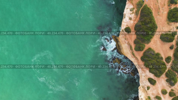 High Angle Aerial View Sandy Beach Line And Cliff Coastline With Grotto. Стоковое видео, видеограф Кирилл Трифонов / Фотобанк Лори