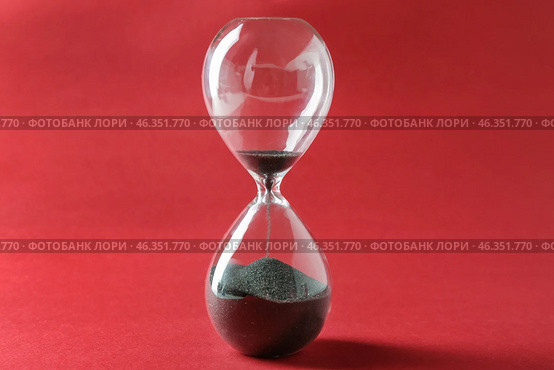 Hourglass on color background. Time management concept. Стоковое фото, фотограф Pixel_shot / Фотобанк Лори