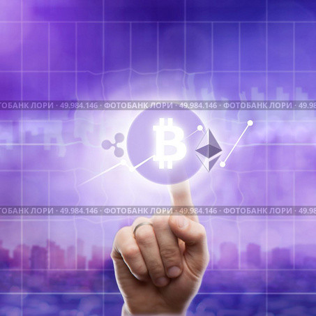 Icons bitcoin, ripple, ethereum and cryptocurrency graph on virtual screen on an ultra violet background of a modern city. The hand touches the bitcoin icon. Blockchain Business, Finance and technology concept.. Icons bitcoin ripple, ethereum on an ultra purple background of the city. The hand touches the bitcoin icon. Стоковое фото, агентство Ingram Publishing / Фотобанк Лори