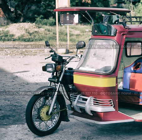 in asia philipphines the typical tuk tuk motorbike for tourist. Стоковое фото, агентство Ingram Publishing / Фотобанк Лори