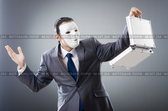 Industrial espionate concept with masked businessman. Стоковое фото, агентство Ingram Publishing / Фотобанк Лори