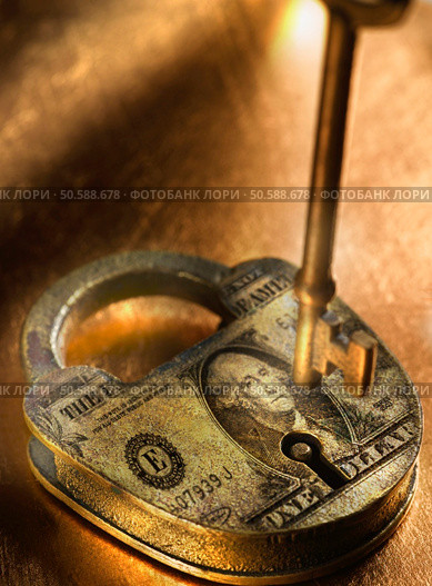 Key and lock with US Dollar bill imprinted on it. 24316813. Стоковое фото, агентство Ingram Publishing / Фотобанк Лори