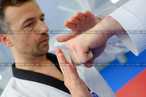 Kid in a karate lesson. Стоковое фото, агентство Ingram Publishing / Фотобанк Лори