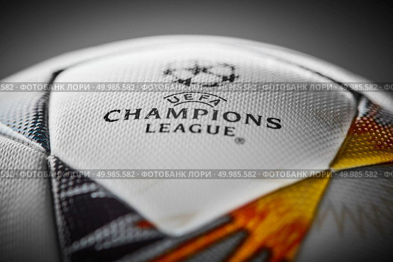 Kiev, Ukraine - February 22, 2018: The upper part of the Official Ball Adidas with Ukrainian symbols for the final of the Champions League on a gray background, there is the inscription final of the Champions League 2017-2018 will be held in Kiev on May 26.. Kiev, Ukraine - February 22, 2018: Official Ball Adidas with Ukrainian symbols for the final of the Champions League. Редакционное фото, агентство Ingram Publishing / Фотобанк Лори