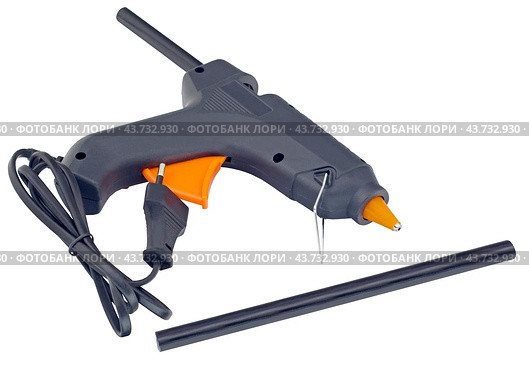 Клеевой пистолет на белом фоне. Electric hot glue gun isolated on white background. Стоковое фото, фотограф Татьяна Д / Фотобанк Лори