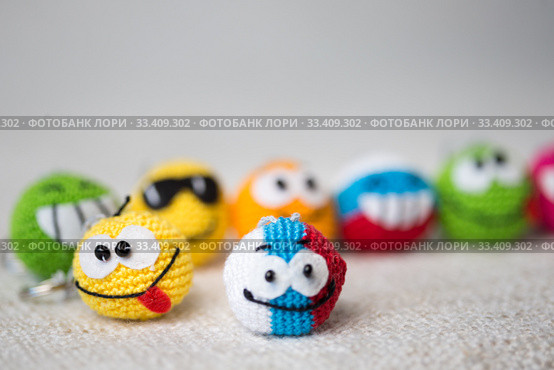 knitted emoticons , background. Стоковое фото, фотограф Типляшина Евгения / Фотобанк Лори