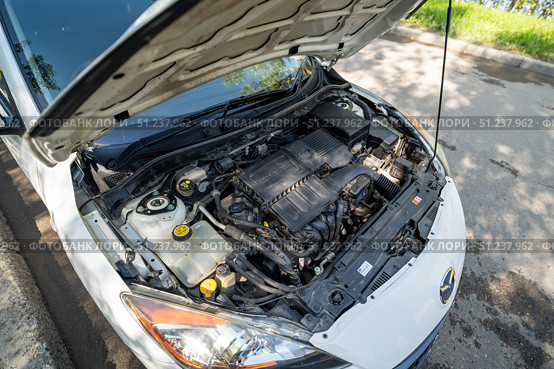 KRASNOYARSK, RUSSIA - August 19, 2025: White Mazda Axela. Редакционное фото, фотограф Плотников Дмитрий / Фотобанк Лори