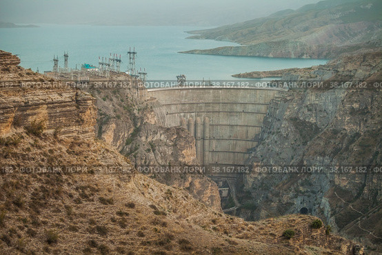 Large arch dam of a hydroelectric power station on a river in a rocky canyon. Dagestan, Russia. Стоковое фото, фотограф Сергей Цепек / Фотобанк Лори