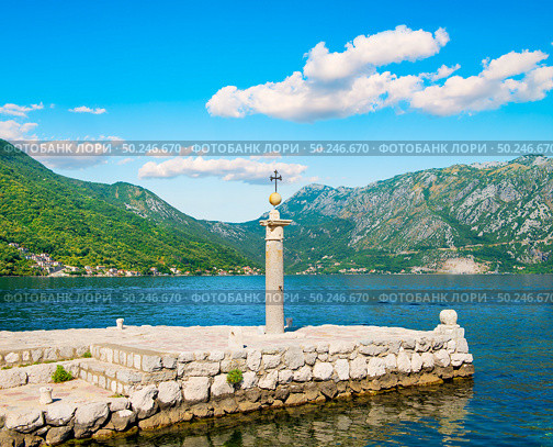 Lighthouse on island Lady of the Rocks. Lighthouse on the artificially built island of Our Lady on the Rock near Perast, Montenegro. Стоковое фото, агентство Ingram Publishing / Фотобанк Лори