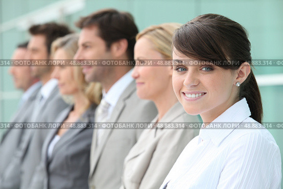 Line up of employees with the youngest in focus. Стоковое фото, агентство Ingram Publishing / Фотобанк Лори