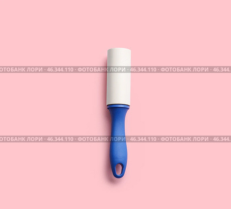 Lint roller on color background. Стоковое фото, фотограф Pixel_shot / Фотобанк Лори