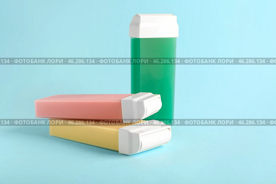 Liposoluble wax cartridges on color background. Стоковое фото, фотограф Pixel_shot / Фотобанк Лори