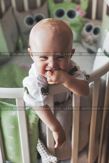 Little One's Grin Lights up Early Morning in the Nursery. Стоковое фото, фотограф Aleksandr Golubev / Фотобанк Лори