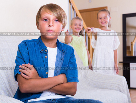 Little sisters teasing big brother. Стоковое фото, фотограф Яков Филимонов / Фотобанк Лори