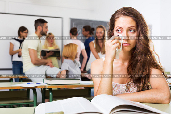 Lonely sad student in the classroom. Стоковое фото, фотограф Яков Филимонов / Фотобанк Лори