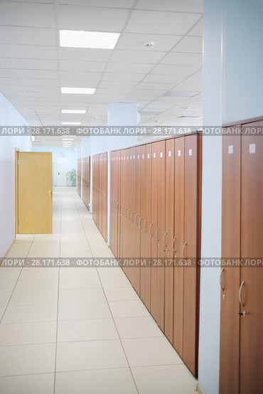Long hallway with many wooden cabinets and opened door in office. Стоковое фото, фотограф Losevsky Pavel / Фотобанк Лори