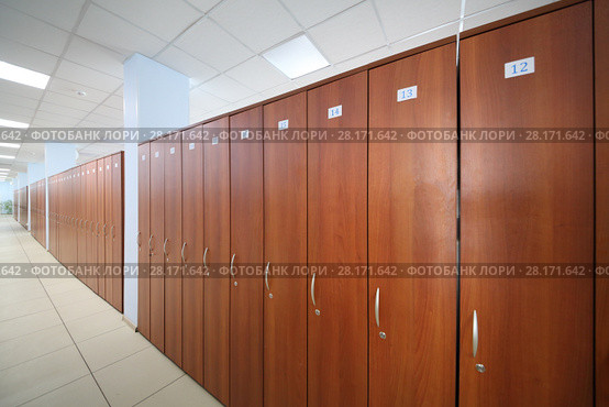 Long hallway with many wooden cabinets in big office of company. Стоковое фото, фотограф Losevsky Pavel / Фотобанк Лори