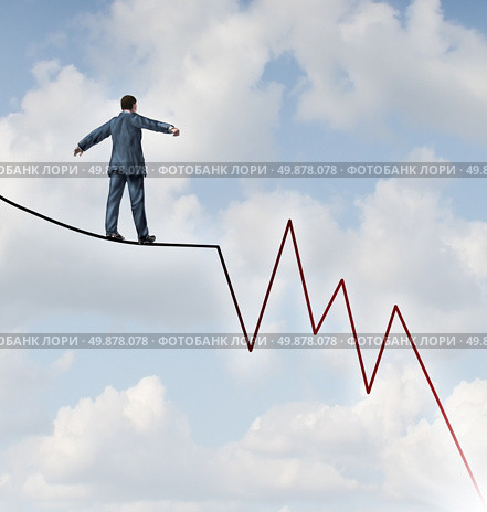 Losing Profit risk and Investment danger as a financial and business concept or metaphor facing wealth adversity as a businessman walking on a high wire tight rope shaped as a negative and downward stock market sell graph. Стоковое фото, агентство Ingram Publishing / Фотобанк Лори