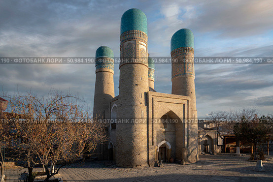 Madrasah of Khalif Niyaz-kul (Chor Minor) is a Central Asian madrasah in the historical center of Bukhara on a sunny day, Bukhara, Uzbekistan. Стоковое фото, фотограф Ula Ulachka / Фотобанк Лори
