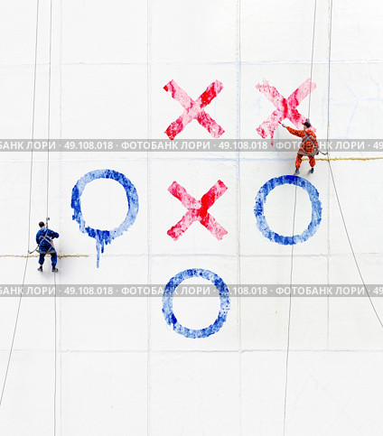 Maintenance workers  play tick-tack-toe  outside a wall . Стоковое фото, агентство Ingram Publishing / Фотобанк Лори