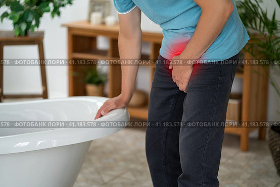 Male fertility concept, pain in prostate, man suffering from prostatitis or from a venereal disease, urological genital infections. Стоковое фото, фотограф Станислав Тарко / Фотобанк Лори