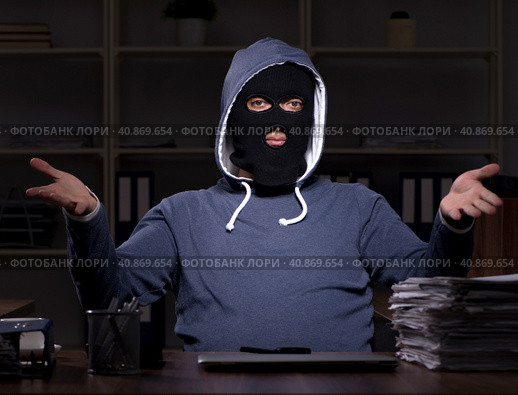 Male thief in balaclava in the office night time. Стоковое фото, фотограф Elnur / Фотобанк Лори