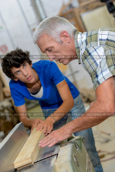 male workers are doing woodworks. Стоковое фото, агентство Ingram Publishing / Фотобанк Лори