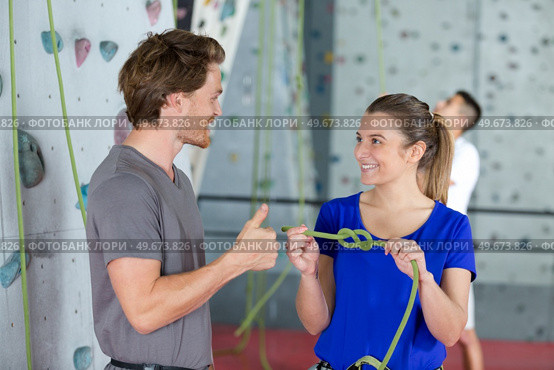 man and woman exercising at indoor climbing gym. Стоковое фото, агентство Ingram Publishing / Фотобанк Лори