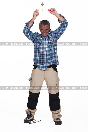 Man being electrocuted. Стоковое фото, агентство Ingram Publishing / Фотобанк Лори