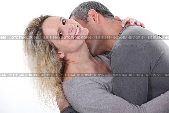 Man kissing wife’s neck. Стоковое фото, агентство Ingram Publishing / Фотобанк Лори