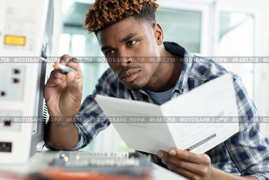man repairing color printer changing toner. Стоковое фото, агентство Ingram Publishing / Фотобанк Лори