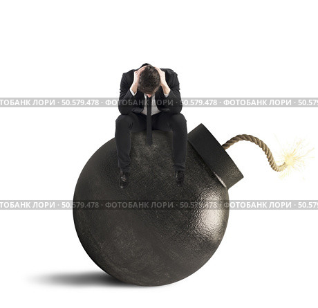 Man sitting on bomb expected to explode. Waiting to explode. Стоковое фото, агентство Ingram Publishing / Фотобанк Лори