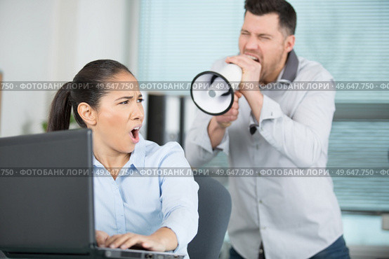 man with megaphone and woman. Стоковое фото, агентство Ingram Publishing / Фотобанк Лори