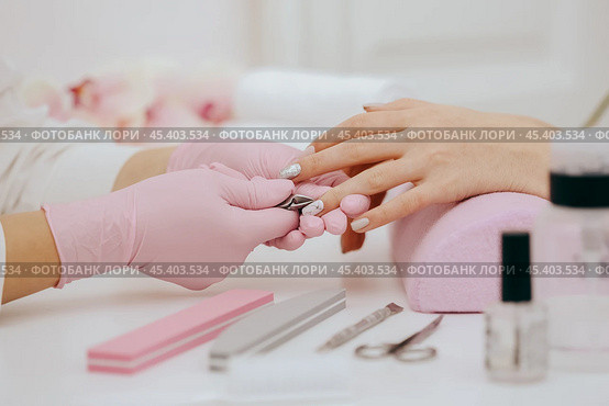 Manicurist does manicure. Стоковое фото, фотограф Сергей Толмачёв / Фотобанк Лори