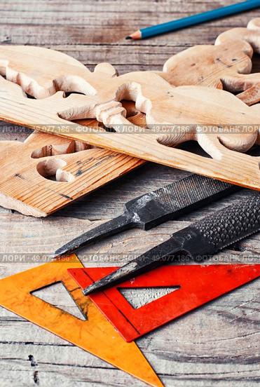 Manually sawn figured wood products and files for wood processing. Work on wood. Стоковое фото, агентство Ingram Publishing / Фотобанк Лори