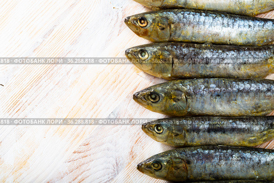 Marinated sardines on wooden table. Стоковое фото, фотограф Яков Филимонов / Фотобанк Лори