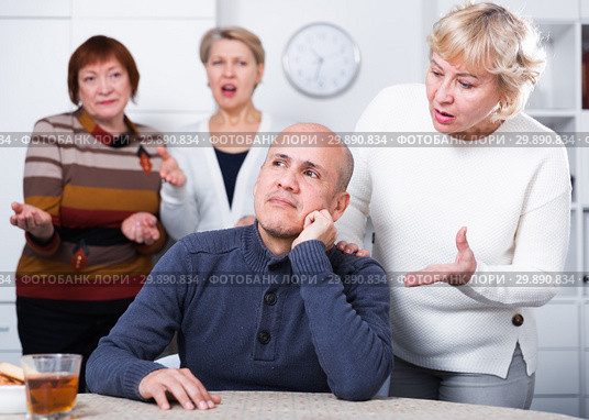 Mature woman is warm apologizing to man after quarrel. Стоковое фото, фотограф Яков Филимонов / Фотобанк Лори